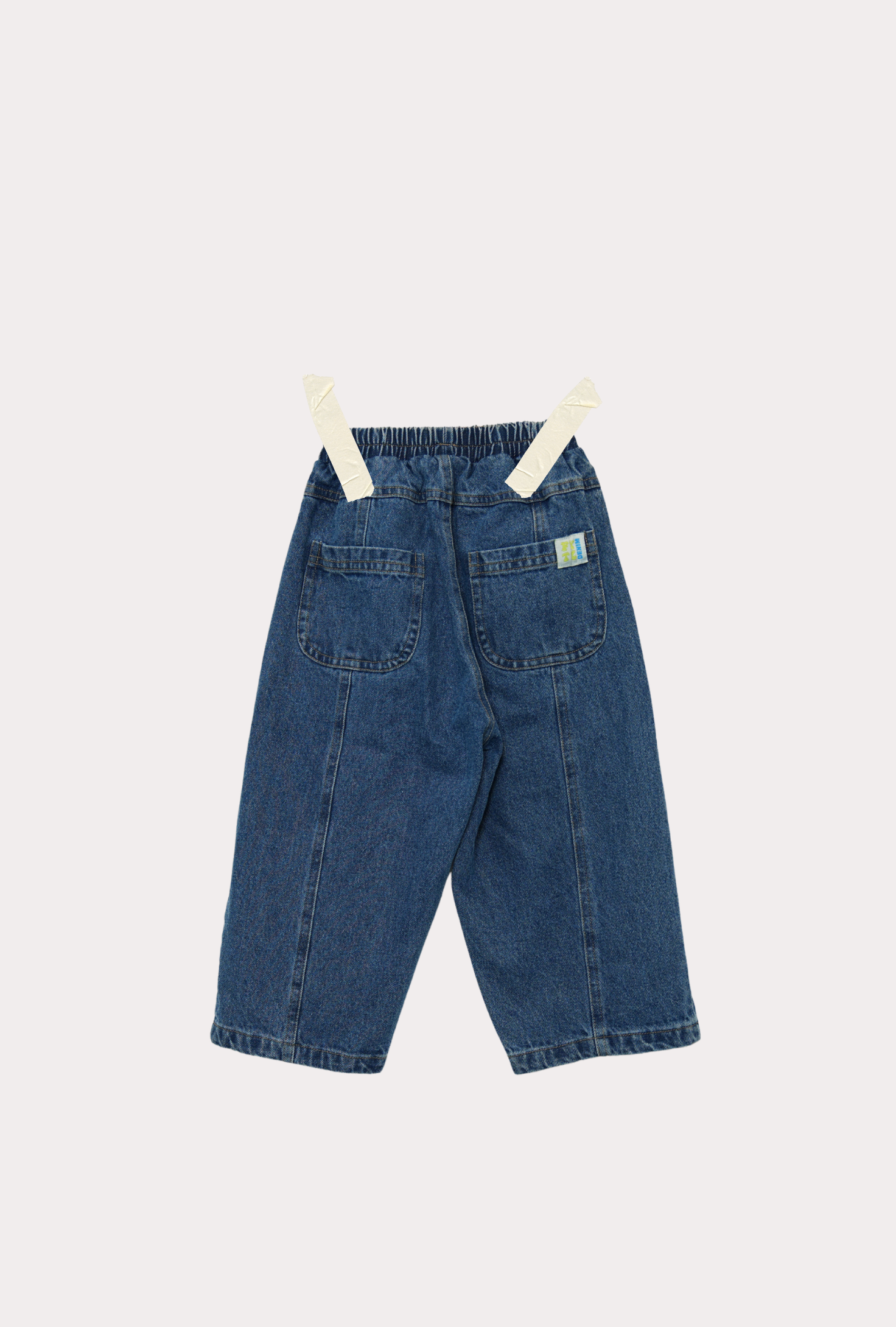 the back of Ruhi wide leg barrel fit denim jean in true blue