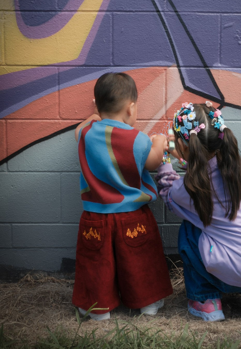 Toddler wearing Blaze red cord pants with elastic waistband — From Y To Z