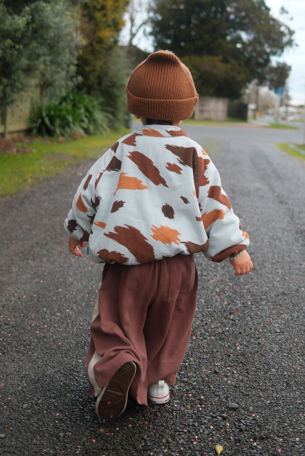 Toddler walking wearing seffi jacket in milkyway
