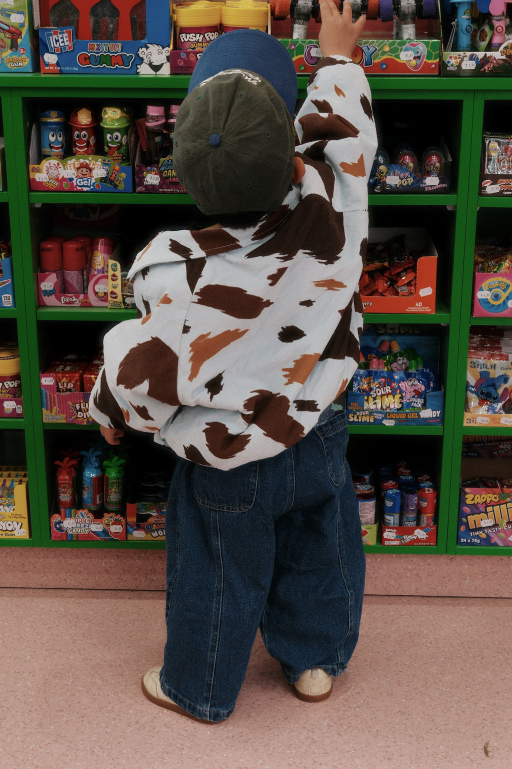 Toddler in convenience store wearing seffi jacket in milkyway