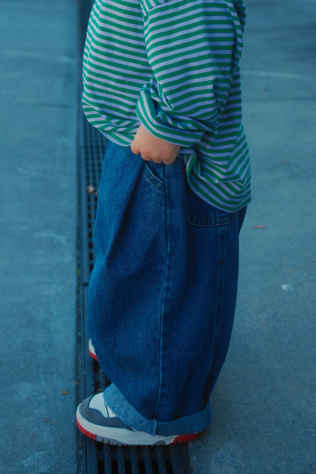 Toddler standing wearing ruhi denim jean in true blue 