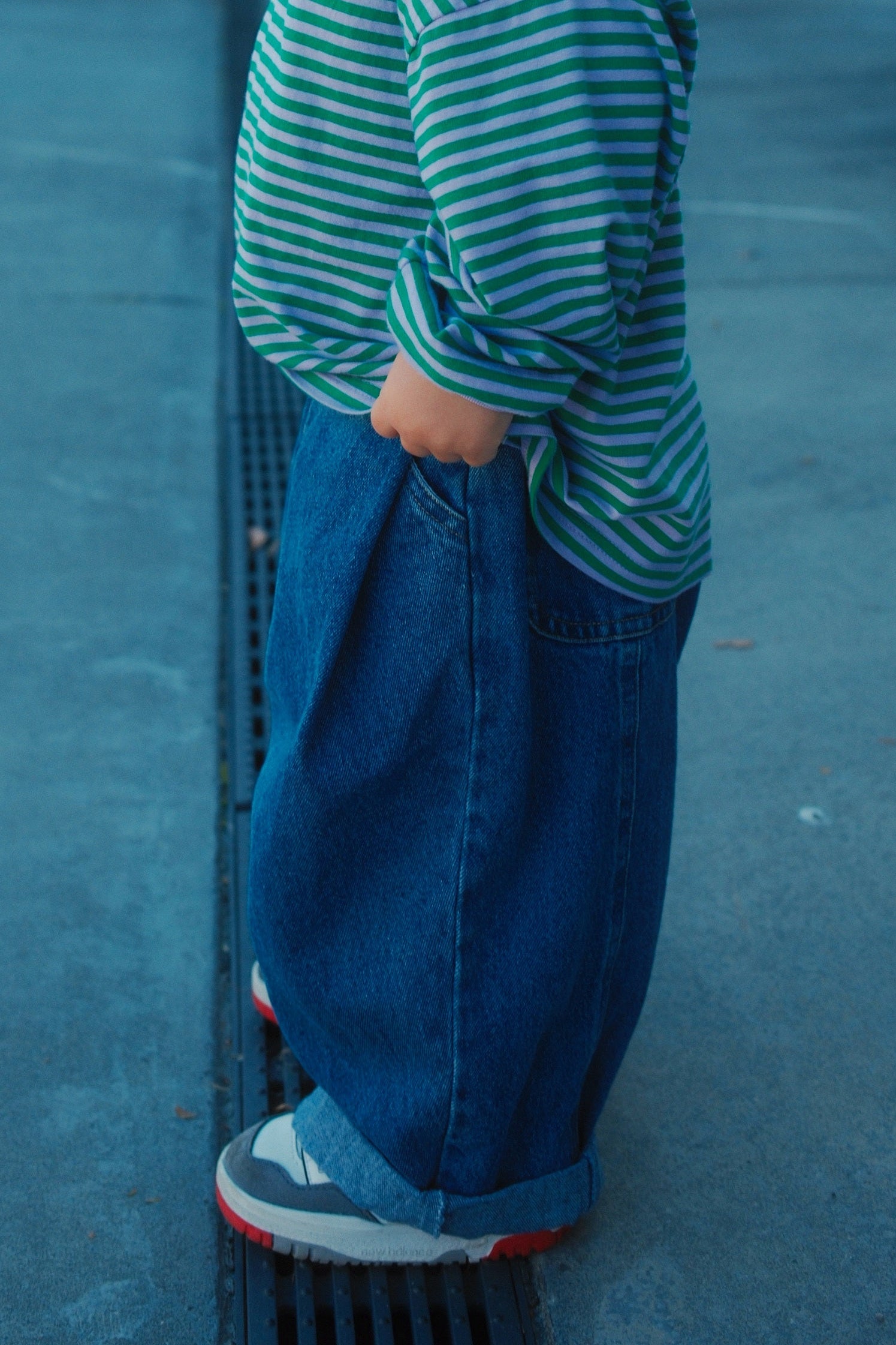 Toddler standing wearing ruhi denim jean in true blue 